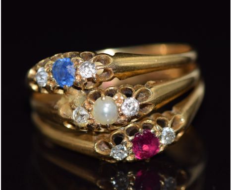 An 18ct gold ring made up of three rings, one&nbsp; set with a pearl and diamonds, the other a sapphire and diamonds and the 