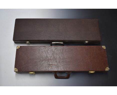 Two vintage gun cases, both with leather style finish and fitted interiors, largest 82x24x8cm.&nbsp;