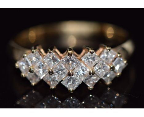 An 14ct gold ring set with 16 princess cut diamonds, total diamond weight approximately 0.96cts, 3.6g,&nbsp;size R&nbsp;