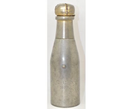 Early 20thC novelty table lighter in the form of a bottle of champagne, the top having reservoir for the lighter, in the lowe