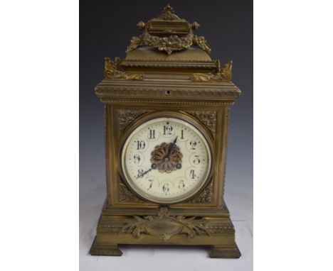 19thC brass cased mantel clock, the anonymous two train movement stamped 354 striking on a gong, the Arabic dial in ivory col