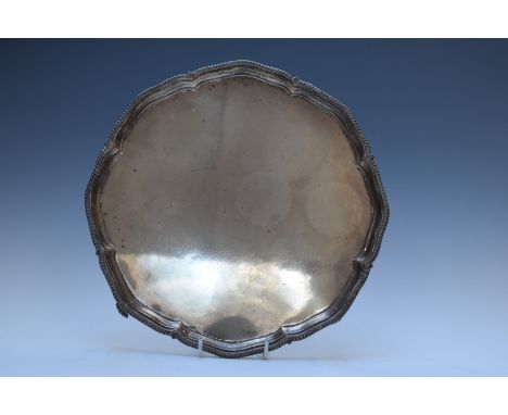 George V hallmarked silver salver with shaped gadrooned edge, raised on four feet, Sheffield 1918, maker&nbsp;Harrison Brothe