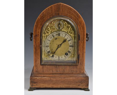 Winterhalder and Hoffmeier mitre cased mantel clock with brass spandreled dial and arch, silvered Roman chapter ring and two 