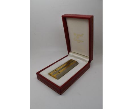 Cartier silver and gold plated lighter with screwed on panel decoration, in original Must de Cartier box with paperwork, L7cm