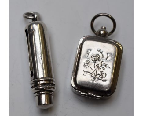 Novelty white metal roller or coil type stamp dispenser, marked sterling silver, length 5.5cm and a small pendant containing 