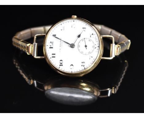 J W Benson 9ct gold wristwatch with subsidiary seconds dial, blued hands, black Arabic numerals, white enamel dial and 15 jew