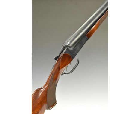 Baikal IJ-58-M 12 bore side by side shotgun with heavy engraving of dogs to the locks, chequered semi-pistol grip and forend,
