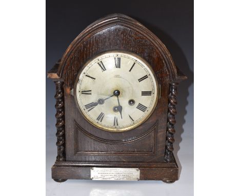 Gustav Becker c1920 oak cased mitre top mantel clock with barley twist decoration, the Roman dial signed Hilser of Tonbridge,
