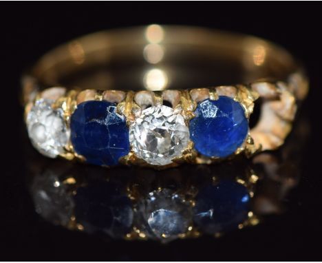 A c1900 18ct gold ring set with cushion cut sapphires each approximately 0.4cts and round cut diamonds, total diamond weight 