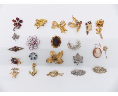 A collection of vintage brooches including three silver, Boucher, cameo, etc