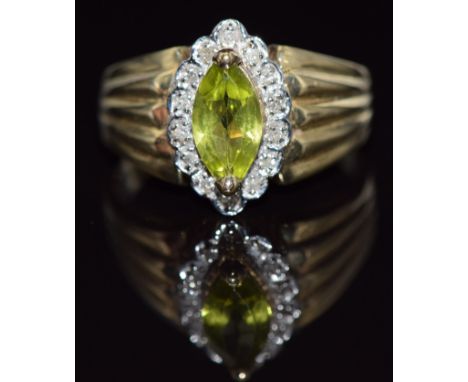 A 9ct gold ring set with a marquise cut peridot surrounded by diamonds, 4.0g, size R&nbsp;