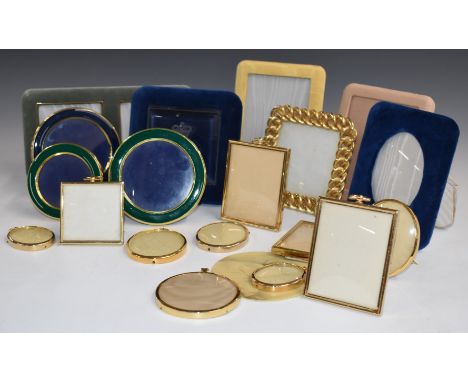 Photograph and portrait miniature frames to include three circular enamel examples, one with engraved royal motto, most havin