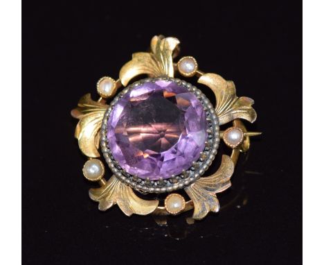 Edwardian gold pendant/ brooch set with a large round cut amethyst and seed pearls, 2.4cm, 4.5g
