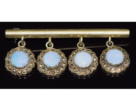 A 9ct gold bar brooch set with opal doublets and marcasite, 10.4g, 5cm long&nbsp;