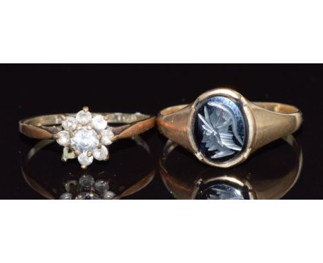 A 9ct gold ring set with cubic zirconia and a 9ct gold signet ring set with a hematite intaglio, 3.3g, size J and Q/R&nbsp;