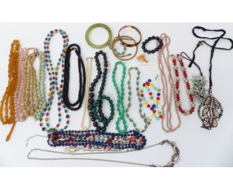 A collection of beaded necklaces including pearl, bloodstone and vintage examples, a hardstone bangle, two serpent bangles, e