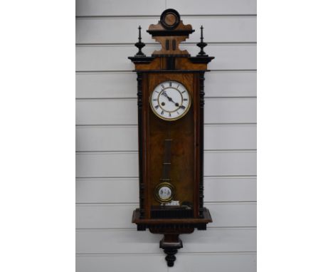 Vienna regulator wall clock the enamel Roman dial with gilt bezels, with ebonised decoration to case and two train movement s