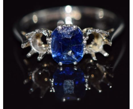 An 18ct white gold ring set with a cushion cut sapphire of approximately 0.75cts in a platinum setting, 2.9g,&nbsp;size K&nbs