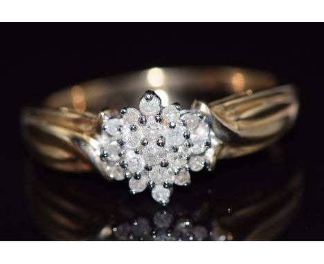 A 9ct gold ring set with diamonds in a cluster, total diamond weight approximately 0.25ct, 3.6g,&nbsp;size R/S