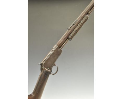 Winchester Model 1890 .22 pump-action rifle with adjustable sights and 24 inch octagonal barrel stamped 'Manufactured by The 