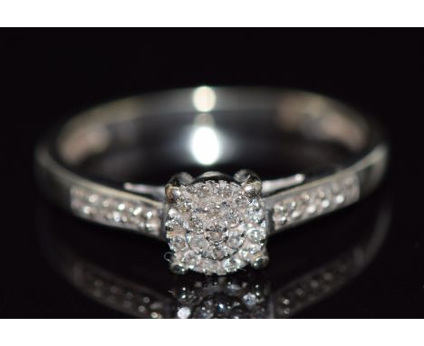 A 9ct white gold ring set with diamonds, 1.9g, size K