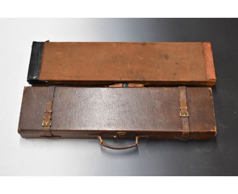 Two vintage canvas and leather bound gun cases, both with fitted interiors, largest 83x21x8cm.&nbsp;
