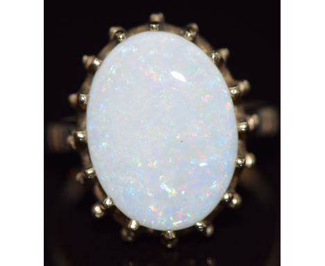 A 9ct gold ring set with an oval cut white opal, 4.5g,&nbsp;size O&nbsp;