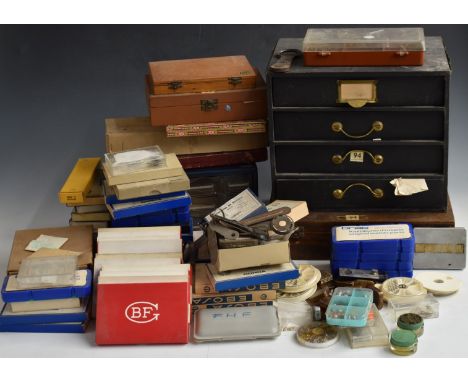 A collection of watchmaker's or repair tools and parts including Tour A Pivoter, movements, glasses, keys etc, many in origin