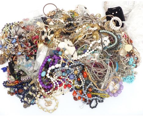 A collection of costume jewellery including vintage brooches, beads, necklaces, etc&nbsp;