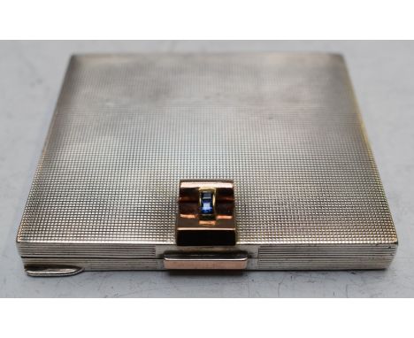 Art Deco hallmarked silver engine turned powder compact with gold detailing set with two square sapphires, London 1946, maker