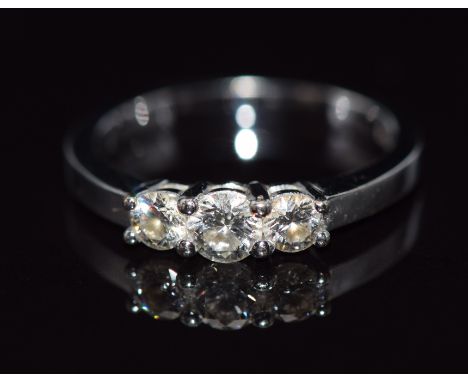 An 18ct white gold ring set with three diamonds, total diamond weight approximately 0.5cts, 3.2g,&nbsp;size K&nbsp;