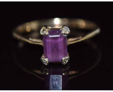 A 9ct gold ring set with an emerald cut amethyst,1.4g, size N