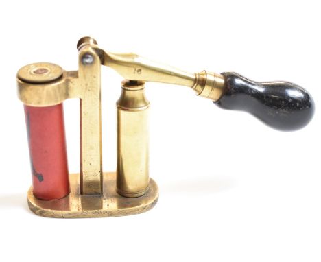 Brass 16 bore shotgun cartridge capper and decapper tool with turned wooden handle and Eley shotgun cartridge case.&nbsp;