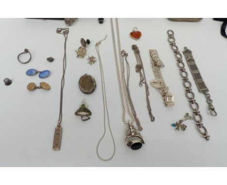 A collection of silver jewellery including pendant set with amber, locket, cigarette case, ring with opening locket section, 