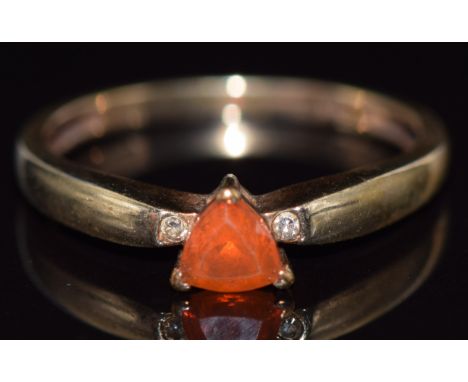 A 9ct gold ring set with a trilliant cut fire opal and diamonds, 1.9g, size O