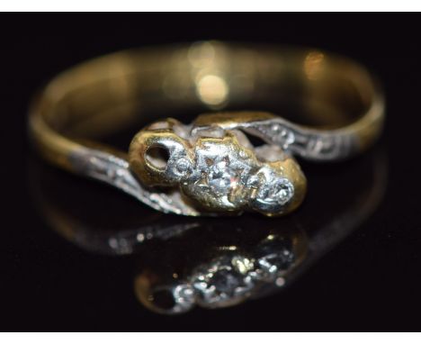 An 18ct gold ring set with diamonds in a twist setting, 1.8g,&nbsp;size J/K&nbsp;