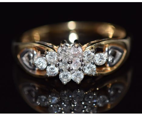 A 9ct gold ring set with diamonds in a cluster, total diamond weight approximately 0.5ct, 3.6g,&nbsp;size R