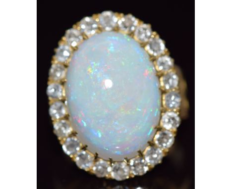 Victorian 18ct gold ring set with an oval opal cabochon of approximately 7cts surrounded by old cut diamonds, 8g,&nbsp;size L