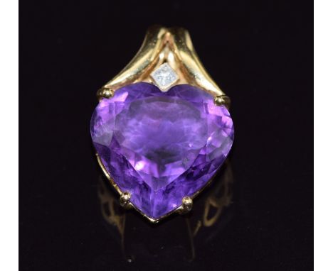 An 18ct gold pendant set with a heart cut amethyst and a diamond, 7.8g, 2.8 x 1.8cm&nbsp;
