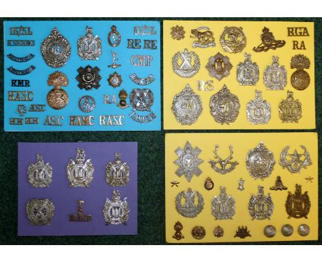 Four prepared boards of regimental badges, buttons and shoulder titles including King's Own Scottish Borderers, Royal Corps o