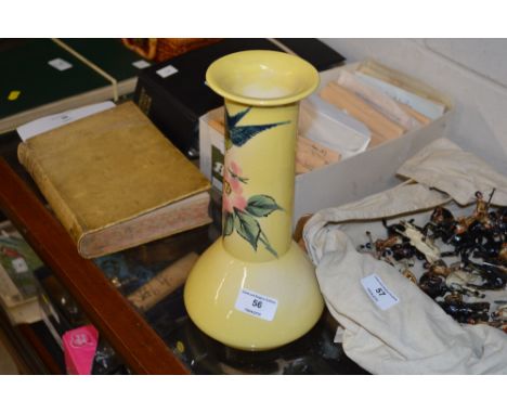 An Ault baluster vase decorated with swallows and foliage