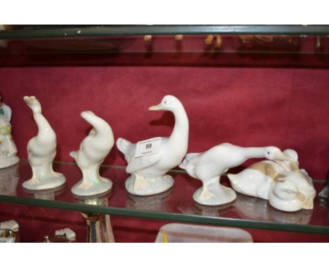 Three Lladro and two Nao geese ornaments 