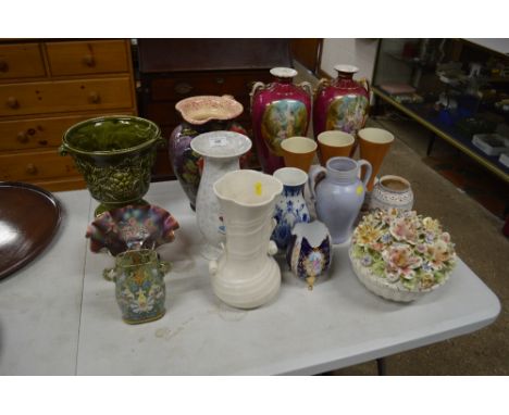 A quantity of various pottery jugs, vases, a Carnival glass bowl and a green and enamel decorated glass vase