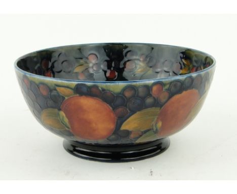 A Vintage Moorcroft bowl 
with tube-lined design of pomegranates, 8" diameter.