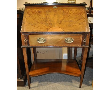 An Edwardian mahogany and satinwood lady's bureau,
with pierced brass gallery, fitted interior, single drawer and shaped shel