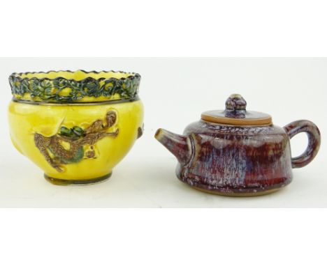 A Chinese pot with dragon design,
height 3.25" and a small Chinese teapot.