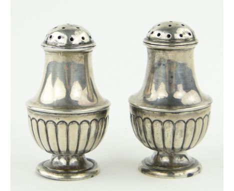 Pair of small silver urn shaped pepperettes,
by Hilliard & Thomason, Birmingham 1916, height 6cm.