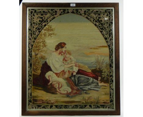 A woolwork cross-stitch tapestry
in oak frame, height 34" overall.