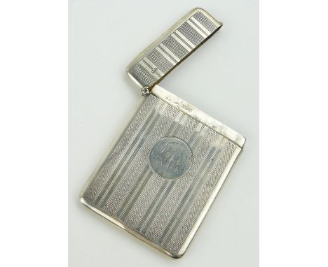 An Edwardian engine turned silver card case,
Chester 1909, height 9.5cm.