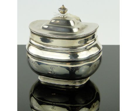 A silver tea caddy of bulbous oval form,
makers marks R & W S, London 1912.